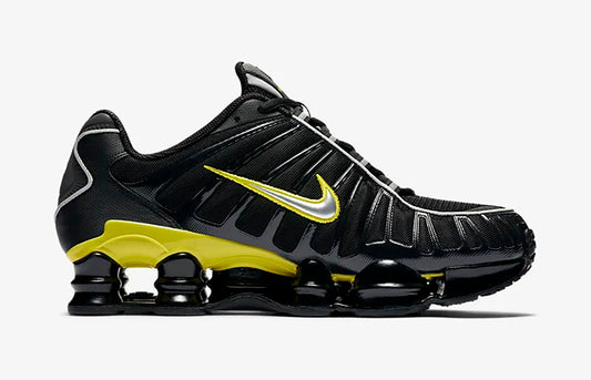 Nike Shox TL trainers in black and yellow